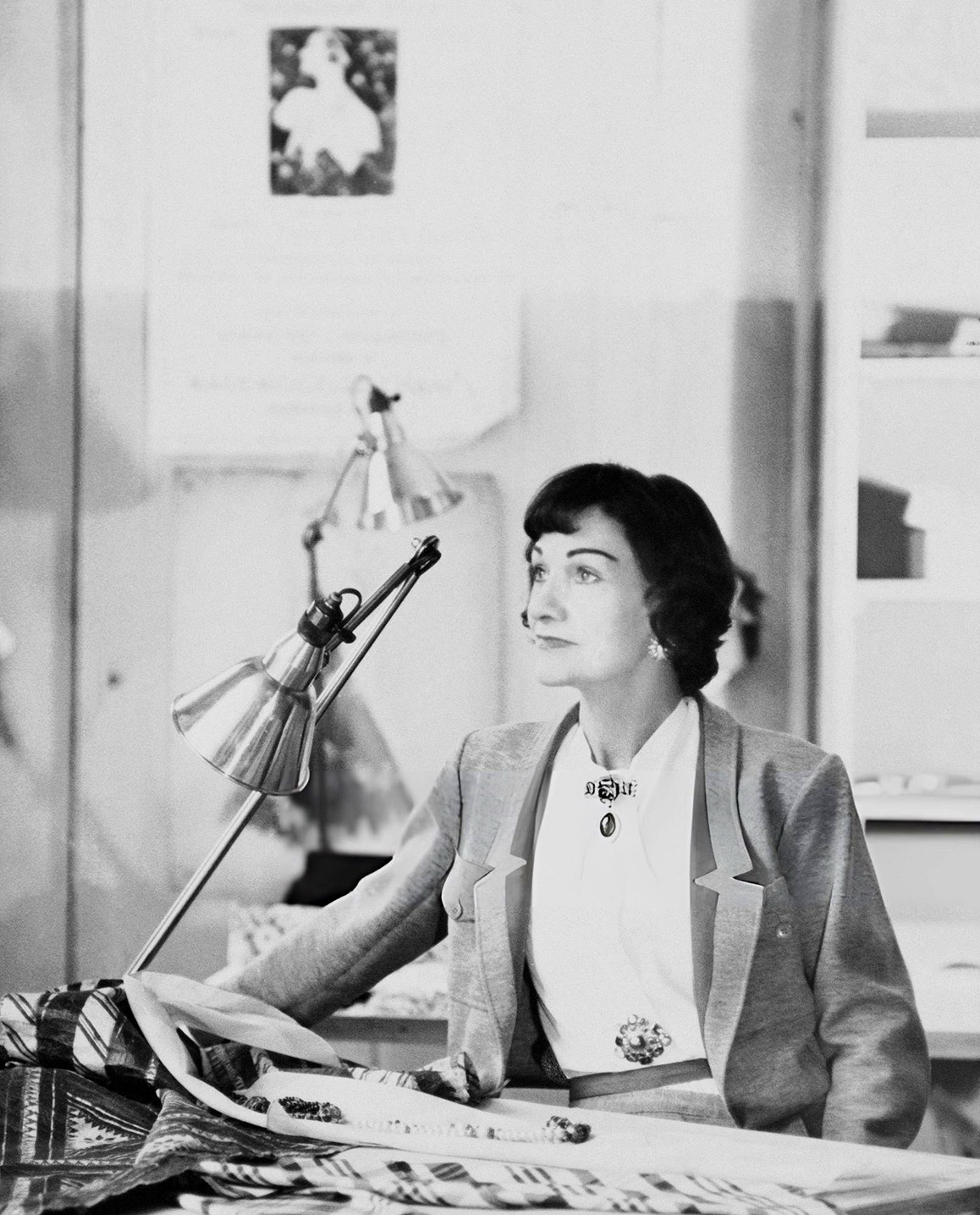 Coco Chanel working in her atelier
