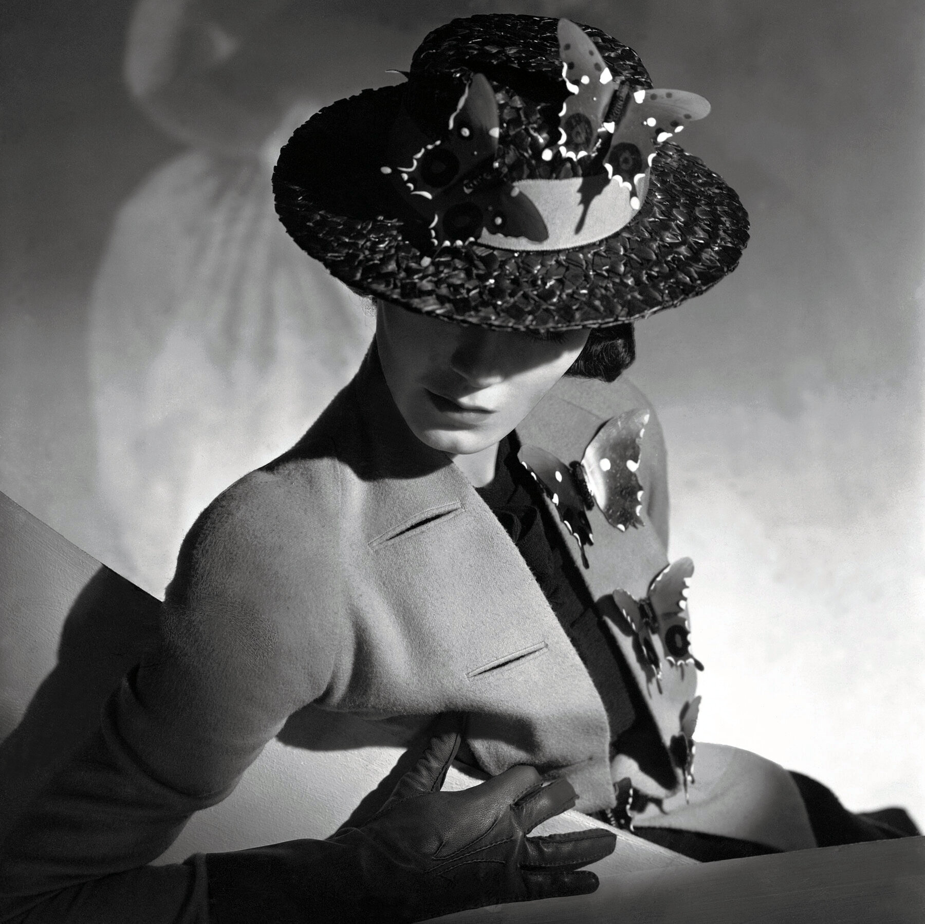 Schiaparelli jacket with butterfly-trimmed hat